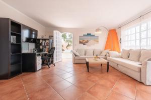 a living room with a couch and a table at Mar Celeste in Puerto de la Cruz