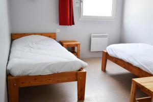 Postel nebo postele na pokoji v ubytování Auberge La Digue + 25 fotografií