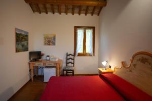 Postel nebo postele na pokoji v ubytování Agriturismo Zennare