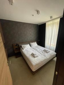 Postel nebo postele na pokoji v ubytování Woodside Apartment
