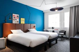 Postel nebo postele na pokoji v ubytování ibis Lausanne Centre