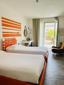 Postel nebo postele na pokoji v ubytování Hotel Al Campanile - Luxury Suites & Apartments