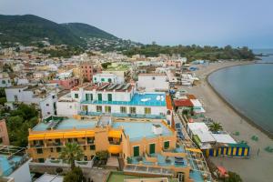 an aerial view of a town next to the beach at Hotel Rivamare in Ischia