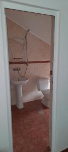 a bathroom with a sink and a toilet at Къща за гости Сара in Velingrad