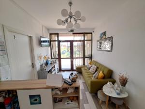 a living room with a couch and a table at Sweet Desire in Vama Veche