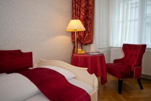 Rúm í herbergi á Pertschy Palais Hotel