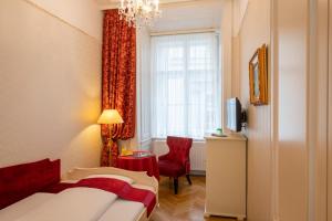 Rúm í herbergi á Pertschy Palais Hotel