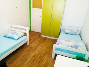 Postel nebo postele na pokoji v ubytování Chillax Rooms