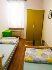 Postel nebo postele na pokoji v ubytování Chillax Rooms