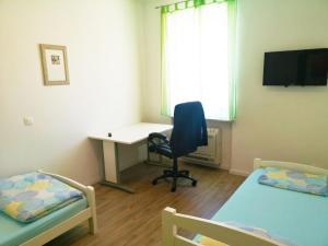 TV a/nebo společenská místnost v ubytování Chillax Rooms