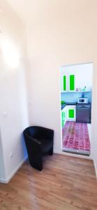TV a/nebo společenská místnost v ubytování Chillax Rooms