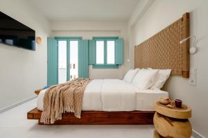 álas cycladic suites客房内的一张或多张床位