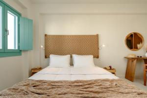 álas cycladic suites客房内的一张或多张床位