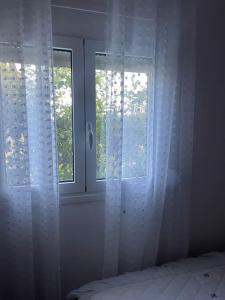 Postel nebo postele na pokoji v ubytování Marias House Rafina
