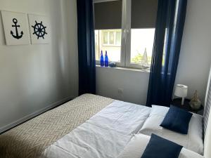 Posteľ alebo postele v izbe v ubytovaní REDA - Pokoje z niezależnym wejściem