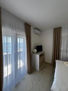 Ένα ή περισσότερα κρεβάτια σε δωμάτιο στο Villa Isola