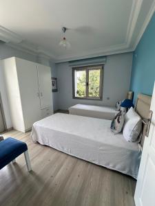 Ein Bett oder Betten in einem Zimmer der Unterkunft Fener Hotel Café & Kahvalti