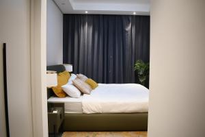 Ένα ή περισσότερα κρεβάτια σε δωμάτιο στο Gracey Concierge Apartments - Avenue Uvira +37 φωτογραφίες