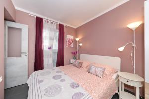 En eller flere senge i et værelse på City apartment Marcela