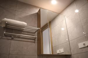 Ένα μπάνιο στο Gracey Concierge Apartments - Avenue Uvira