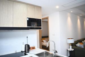 Η κουζίνα ή μικρή κουζίνα στο Gracey Concierge Apartments - Avenue Uvira