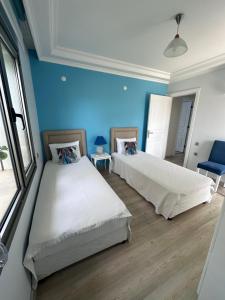 Ein Bett oder Betten in einem Zimmer der Unterkunft Fener Hotel Café & Kahvalti