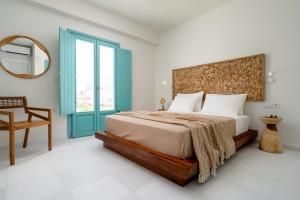 álas cycladic suites客房内的一张或多张床位