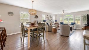 a dining room and living room with a table and chairs at 55C Anchors Away II at True Blue condo by Peace Vacations in Pawleys Island