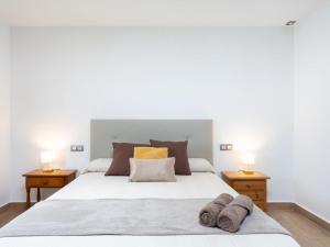 a bedroom with a large white bed with two lamps at Holiday Home Borges Fuente by Interhome in La Orotava