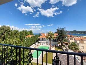 a view from the balcony of a house with a swimming pool at Blue Bay Hotel in Iraklitsa