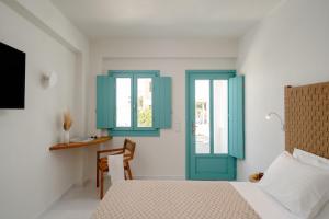álas cycladic suites客房内的一张或多张床位