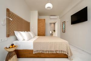 álas cycladic suites客房内的一张或多张床位