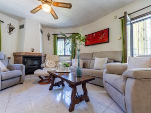 a living room with a couch and a table at Holiday Home Reca by Interhome in L'Ampolla
