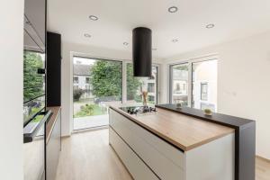 a kitchen with a large island with a counter top at Apartment Božica in Ljubljana