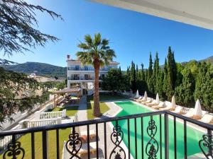 a view from the balcony of a resort with a swimming pool at Blue Bay Hotel in Iraklitsa