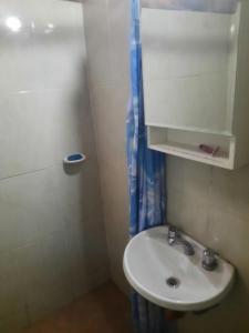a bathroom with a sink and a shower at Hostel El Submarino in San Agustín de Valle Fértil +31 photos