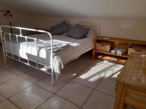 a bedroom with a bed and a table at La Casita in Buenos Aires