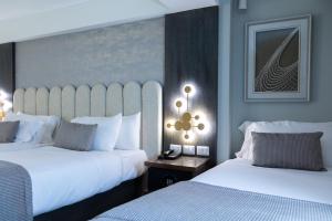 En eller flere senger på et rom på Hotel HW High Wellness