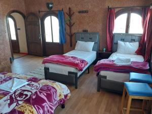 Postel nebo postele na pokoji v ubytování Sud Est Palace