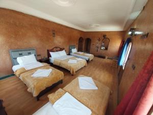 Postel nebo postele na pokoji v ubytování Sud Est Palace