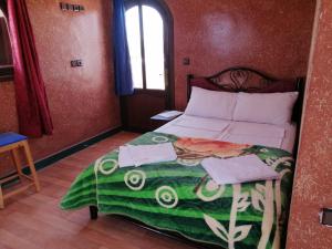Postel nebo postele na pokoji v ubytování Sud Est Palace
