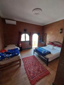 Postel nebo postele na pokoji v ubytování Sud Est Palace