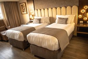 En eller flere senger på et rom på Hotel HW High Wellness