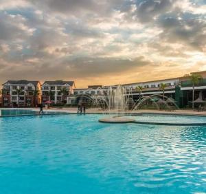 a large swimming pool with a fountain in the middle at 521 at The Blyde in Pretoria