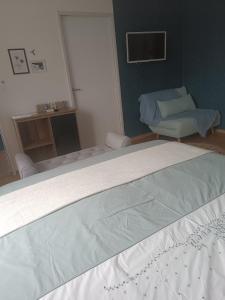 a hospital room with a bed and a chair at Le domaine de Moïse in La Fouillade +14 photos