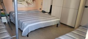 Postel nebo postele na pokoji v ubytování Alghero sun
