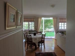 a dining room with a table and chairs at Deja Vu Cottage in Sedgefield