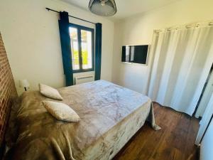 Postel nebo postele na pokoji v ubytování L'Apt Tropez