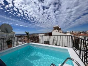 a swimming pool on the balcony of a apartment at Naim Guest House Nerja - Adults only in Nerja