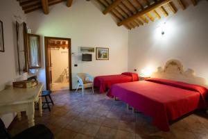Postel nebo postele na pokoji v ubytování Agriturismo Zennare